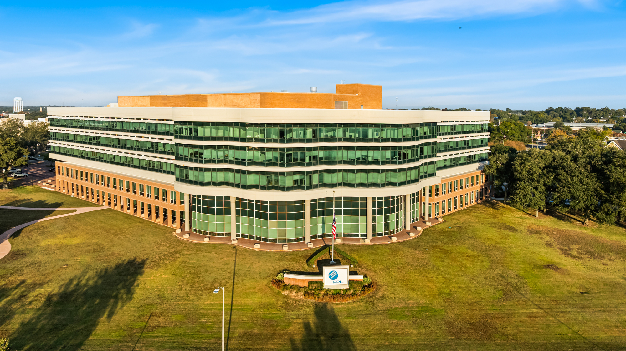 Aerial view of One Energy Place, a five-story Class A waterfront office building in Pensacola, Florida.